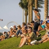 Families sitting on Yas Marina hill